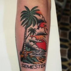 a man's arm with a palm tree and sunset on it, which reads semester