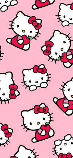 hello kitty wallpaper in pink with red bows and hearts on the bottom right corner