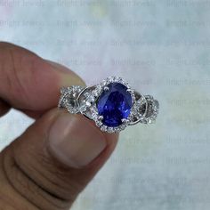 ITEM DESCRIPTION ✦ Handmade, high-quality item! ✦ Material: SOLID 925/10/14K GOLD (can be made in Silver/white/rose/yellow gold) ✦ Center stone: Blue Sapphire ( Lab Created) ✦ Side Stone: Simulated Diamond ✦ Center Stone Size: 9x7mm Oval ✦ Stone Weight: 2.50TCW ✦ Cut - Excellent ✦ Color: Blue ✦ Clarity: VVS1 ✦ Mohs Hardness: 9.25 ✦ Certification: On Request ✦ Metal Weight: 4.5 Gram Approx ✦ Style: Halo ✦ Setting: Prong ✦ Hallmark: 925/10K/14K Stamp ✦ Country of Manufacture: India ✦ Condition: Br Oval Sapphire Ring With Halo Setting In Moissanite, Oval Sapphire Moissanite Ring With Center Stone, Oval Sapphire Moissanite Ring, Oval Sapphire Ring With Moissanite Halo Setting, Oval Moissanite Sapphire Ring Gift, Gia Certified Oval Sapphire Ring, Oval Sapphire Ring With Halo Setting In Sterling Silver, Gift Oval Sapphire Moissanite Ring, Luxury Silver Oval Sapphire Ring