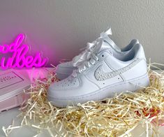 Make your day extra special with these beautiful and unique custom bridal sneakers! * Brand New 100% Authentic sneakers! * FREE SHIPPING within the US territory!  * Rhinestones/pearls Swoosh Bridal Custom made-to-order sneaker. * Hand-painted lettering on the outer sides of each shoe. Get them Personalized! - Size Guide- C (Child) Y (Youth) W (Women) M (Men.) - Acrylic Waterproof paint - ALWAYS Hand-Pianted, we never use stickers to make sure the shoes last a long time! - Available in Low, Mid, and High styles. - 100 % Authentic products purchased from the original retailer - The sizes are unisex so please don't panic if, for example, you order a 6.5 M and receive an 8 W, THEY ARE EXACTLY THE SAME SHOES and will fit the same. Please refer to the Size Guide. - NO RETURNS. Custom shoes are m Customizable Lace-up Sneakers For Gift, Customizable White Sneakers For Gift, White Low-top Sneakers As Gift, White Custom Lace-up Sneakers As Gift, White Lace-up Custom Sneakers For Gift, White Lace-up Custom Sneakers As Gift, Customizable Lace-up Sneakers For Gifts, Shoes For The Bride, Bridal Sneakers