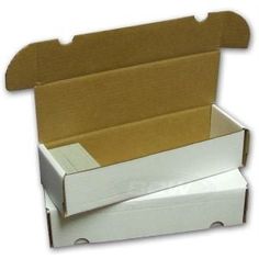 an open box with the lid closed and two boxes stacked on top of each other