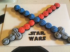 star wars themed cupcakes are arranged in the shape of a x on top of a card