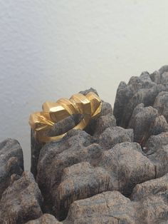 This is a beutifull 14 karat gold plated brass, woman's ring. a rock shape ring with a rustic look. It is a statement ring in a matt finish. -14 k gold plated brass -free shipping worldwide -gift box If you would like to see other rings I have made, please follow this link: https://www.etsy.com/il-en/shop/TamyZurTachshit?ref=seller-platform-mcnav&section_id=17271018 If you would like to go back to my store follow this link: https://www.etsy.com/il-en/shop/TamyZurTachshit?ref=seller-platform- Matte Gold Brass Rings As Gifts, Matte Gold Brass Rings For Gift, Gold Faceted Open Ring, Gold Faceted Open Ring Jewelry, Faceted Gold Open Ring Jewelry, Unique Faceted Gold Rings, Raw Design, Faceted Ring, A Rock