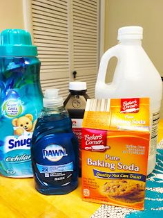 the table is covered with cleaning products and other household care items such as baking soda