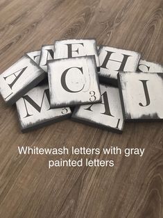 whitewash with gray font on wooden flooring for wall decor or table top art