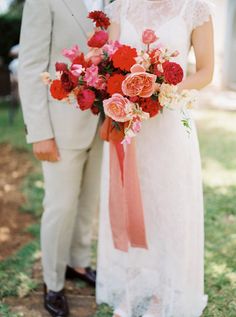 a bride and groom standing next to each other