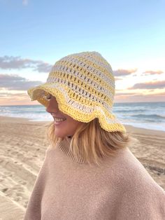 This crochet bucket hat is made by hand! The material is light and soft so perfect for a day at the beach, a fashion piece and even to keep you warm. Yellow Crochet Hat For The Beach, Adjustable Knitted Beach Hats, Brimmed Crochet Beach Hat, Brimmed Crochet Yarn Hat For Beach, Brimmed Crochet Hat For Beach, Brimmed Crochet Yarn Hat For Beach Season, Yellow Hand-knitted Crochet Hat For The Beach, Adjustable Knitted Hats For The Beach, Brimmed Crochet Hat For Beach Season