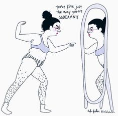 a woman is looking at herself in the mirror and pointing to her face with one hand