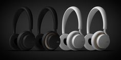 four headphones are lined up against a black background