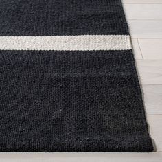 a black and white rug on the floor