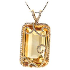 This stunning pendant is sure to turn heads with its bold and beautiful design. The centerpiece of the pendant is a magnificent 51.22 carat emerald cut citrine that is sure to catch the light and shimmer beautifully. The citrine is accented with 1.68 carats of white round diamonds, which add a touch of sparkle and luxury to the piece. The pendant is set in 18 karat yellow gold, which provides a warm and rich backdrop for the vibrant gemstones. The diamonds are expertly set in a diamond halo and Citrine Birthstone, Cognac Diamonds, Pearl Necklace Designs, Citrine Jewelry, Citrine Pendant, Diamond Necklace Set, Modern Necklaces, Bold And Beautiful, Solitaire Pendant