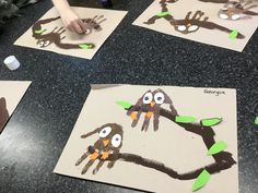 children's handprints made to look like birds on a tree branch