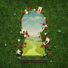 an image of a green field with flowers and pictures in the grass that have been cut out to look like a landscape