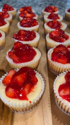 a pan filled with cupcakes sitting on top of a counter next to a light