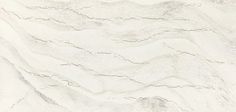 a white marble textured wall with wavy lines