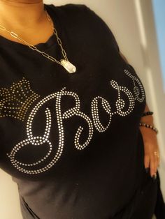 Boss with queen crown rhinestone t shirt. Available in black or white regular unisex shirt. Black Rhinestone T-shirt For Party, Black Crew Neck T-shirt With Rhinestones, Graphic Tee With Rhinestones And Crew Neck, Black T-shirt With Rhinestones For Party, Party T-shirt With Rhinestones And Short Sleeves, Rhinestone Embellished Short Sleeve T-shirt For Night Out, Graphic Tee T-shirt With Rhinestones, Short Sleeve, Rhinestone T Shirt, Boss Tshirt