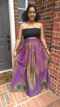 "*African Dashiki Print - Purple and green *Maxi length *3 inches thick waistband *Perfectly pleated waist *Two side pockets *Zipper closure at the back S I Z E C H A R T XS: Waist 25\" - 26\" S: Waist 28\" - 30\" M: Waist 31\"- 32\" L : Waist 33\" - 34\" XL: Waist 35\" - 36\" CUSTOM SIZES (Since these orders use up more fabric, we charge an extra $20). XXL: Waist 37\" - 39\" 3XL: Waist 40\" - 42\" 4XL Waist 43 - 46 Kindly note that due to variations in computer monitors, tablets, and/or mobile Purple Bohemian Maxi Skirt, Casual Purple Flared Maxi Skirt, Bohemian Purple Maxi Skirt For Spring, Long Purple Cotton Skirt, Fitted Bohemian Purple Bottoms, Bohemian Purple Lined Skirt, Purple Bohemian Lined Skirt, Fitted Purple Lined Maxi Skirt, Fitted Purple Flared Maxi Skirt