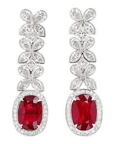 Two rubies totaling 6.02 carats are the stars of these showstopper earrings. The oval gemstones display a highly desirable vivid red hue, a color commonly referred to as pigeon's blood red for its vibrancy, saturation and lack of fluorescence. The stone is certified by Gemresearch Swisslab as being Mozambique in origin and a "GRS-type pigeon blood ruby." Diamonds totaling 3.10 carats join the ruby in its classic 18K white gold setting. 1 1/2" length Download the Certification Luxury Dazzling Ruby Earrings, Luxury Classic Lab-created Ruby Jewelry, Luxury Ruby Earrings With Latkans, Antique Earrings Vintage, Antique Diamond Earrings, Blood Ruby, Diamond Chandelier Earrings, Sapphire And Diamond Earrings, High Jewellery