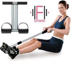 a woman sitting on the ground using an exercise machine