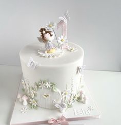 there is a white cake with flowers on it