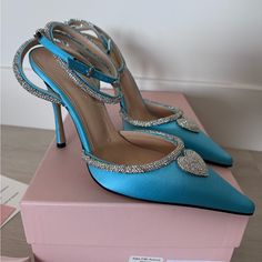 Stunning Pair Of Mach & Mach Heels With A Crystal Heart Detail And Straps Size: 37.5 Color: Ocean Blue Heel Height: 110mm New In Box With Dust Bags And Heel Tips. Purchased From Saks Fifth Avenue Blue Pointed Toe Heels With Rhinestones, Light Blue Heels With Heel Strap For Evening, Blue Rhinestone Pointed Toe Heels, Chic Light Blue Heels For Party, Chic Light Blue Party Heels, Luxury Blue Heels With Rhinestones, Light Blue Ankle Strap Heels For Evening, Elegant Light Blue Heels With Wrapped Heel, Elegant Light Blue High Heels