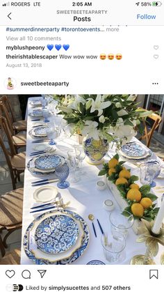 the table is set with blue and white dishes