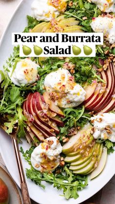 a white plate topped with an apple salad next to bowls of fruit and dips