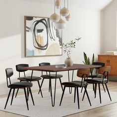 a dining room table with four chairs and a plant in the corner next to it