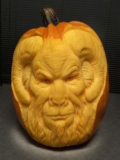 a carved pumpkin with an evil face on it