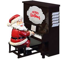 a statue of santa claus playing the piano