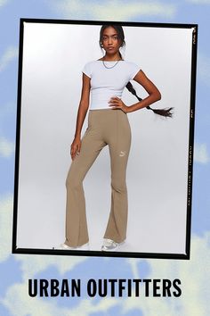 Staple Puma legging in a modern flared silhouette. Designed in a soft & stretchy knit with a mid-rise waist, pintuck leg seams and split hems for an updated look. Features Puma pintuck flared legging Flare yoga pant Soft & stretchy knit Puma logo on front Mid rise waist Pintuck-detail leg Split hems Body-skimming flared fit Full length Easy pull-on style Content + Care 90% Cotton, 10% spandex Machine wash Imported Size + Fit Mid rise Flared leg Full length Model in Black is 5’8" and wearing size Small Measurements taken from size Small Waist: 28" Rise: 11" Inseam: 32" Leg opening: 18.5" | Puma Pintuck Flared Legging Pant in Taupe, Women's at Urban Outfitters Sportswear Yoga Pants With Micro-elastic Contoured Waistband, Yoga Pants With Ribbed Waistband And 4-way Stretch, Sports Flare Pants With 4-way Stretch, 4-way Stretch Yoga Pants With Ribbed Waistband, Sporty Flare Yoga Pants With 4-way Stretch, Puma Leggings, Flare Legging, Puma Logo, Women Men Shoes