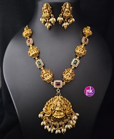 Lakshmi Premium quality Matte gold finish Necklace with Earrings - Traditional Necklace - Temple Jewelry - MK Fashionkart Earrings: Matching Earrings Material: Matte gold finish, AD Stones Suitable for Saree/Salwar/party wear dresses Adjustable length    SHIPPING : Ready to ship in 1 business day. This item will be shipped from The United States. Jewelry care instructions : 1. Please wipe the jewelry with a piece of cotton cloth after usage.  2. Store the jewelry in a cool, dry and air tight box or pouch.  3. Make sure the jewelry is away from direct heat and water. 4. Please wipe of any moisture, sweat, soap water after usage. Laxmi Pendant Gold Temple Jewellery, Salwar Party Wear, Temple Jewelry Necklace, Traditional Necklace, Earrings Matching, Temple Jewelry, Gold Chain Design, Thanks For The Gift, Jewelry Care Instructions