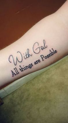 a person with a tattoo on their arm that says, with god all things are possible