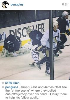 the hockey players are playing on the ice