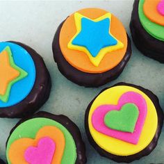 several decorated cookies with hearts and stars on them