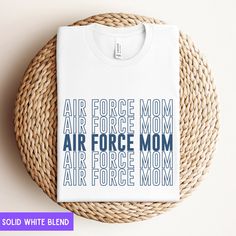 Thank you for visiting SuniDazeDesigns.  Fly high in style with our 'Air Force Mom' shirt! Perfect for moms who soar above the rest, and proudly display your support for your loved one. Whether you're cheering on your Airman or showing support from the ground, wear your title loud and proud. Get yours today and let everyone know who's got the wings in the family! Please carefully read the following... HOW TO ORDER  Choose Your Size Choose Your Shirt Color Select the quantity Click Add To Cart Fo White Tops With Funny Text For Fans, Air Force Mom Shirt, Air Force Mom, Military Mom, Graduation Outfit, Mom Shirts, Unisex Fashion, Air Force, Colorful Shirts