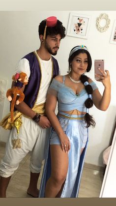 a man and woman dressed up in costumes