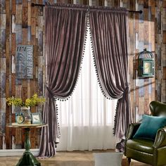 a living room filled with green furniture and walls covered in brown wall papered panels