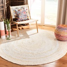 a living room with a chair and rug