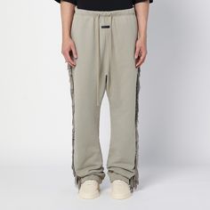 Paris Sky cotton jogging trousers from Fear of God featuring an elasticated waistband with drawstring, two side welt pockets, a leather logo label on the front and tone-on-tone fringing on the sides of the legs. Casual Cotton Pants With Fringe, Casual Bottoms With Tassels For Fall, Valentino Black, 90s Streetwear, Logo Label, Black Leather Shoes, Fear Of God, Gorgeous Bags, Leather Logo