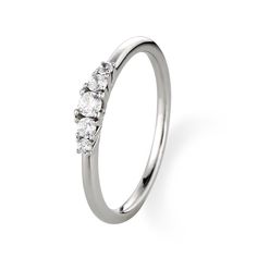 a white gold ring with three stones on the top and bottom, set against a plain background