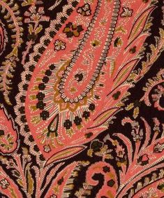 an orange and black paisley print fabric