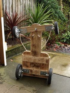 a wooden cart with wheels on the ground