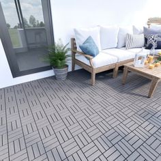 a couch and coffee table on a patio