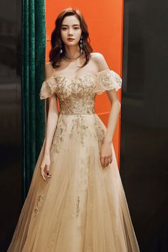 Gold Tulle Evening Gown, Gold Tulle Gown For Prom Season, Gold Debutante Ball Dresses With Sweep Train, Gold Tulle Prom Gown, Glamorous Gold Evening Dress For Debutante Ball, Gold Sweep Train Dress For Debutante Ball, Gold Tulle Gown For Prom, Gold Gown With Sweep Train For Debutante Ball, Champagne Tulle Prom Gown