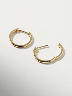 Classic, polished and minimalist-chic, these small slim endless hoops are perfect for everyday wear. Crafted in recycled Sterling Silver and dipped in 14K gold, these hoops come with an endless hoop closure for comfort and ease. Lightweight and hypoallergenic, these small slim endless hoops add a dainty touch to your earring stack. This design is also available in a medium size. • Hypoallergenic hoop earrings crafted in recycled Sterling Silver• High-polish, smooth 14K gold finish • Lightweight, Earring Stack, Bday Gift, Outfit Plan, Minimalist Chic, Earring Crafts, Letter Necklace, Recycled Sterling Silver, Gold Finish, Precious Metals