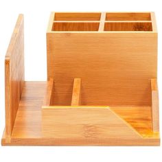 a wooden box with compartments for pens and pencils