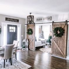 a dining room with wooden doors and chairs