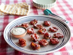 small bites of food on a plate with dip