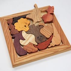 a wooden puzzle with different shapes and sizes